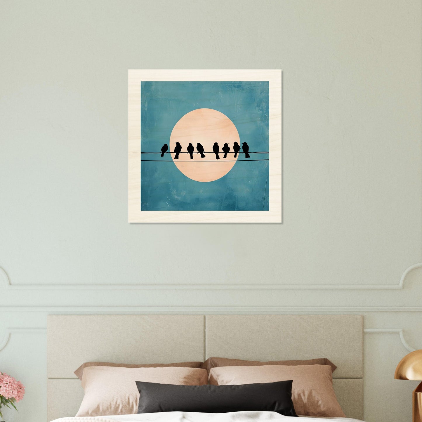 Wooden artwork of birds on a wire with a moon in the background