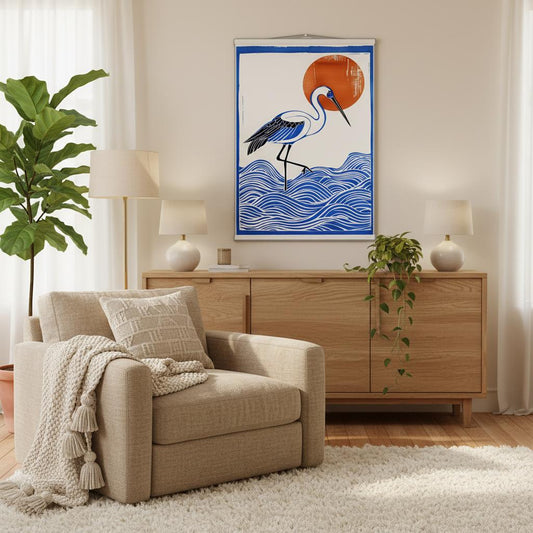 Decorative wall poster with a crane in the sea and sun design in a Living room with beige armchair, wooden sideboard, and decorative wall art.