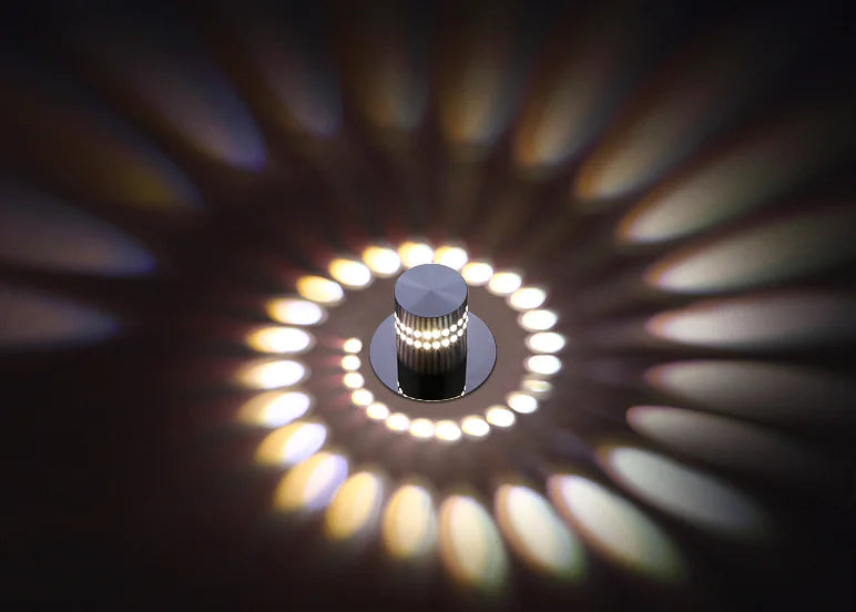 Light bulb with circular pattern of light on a dark background