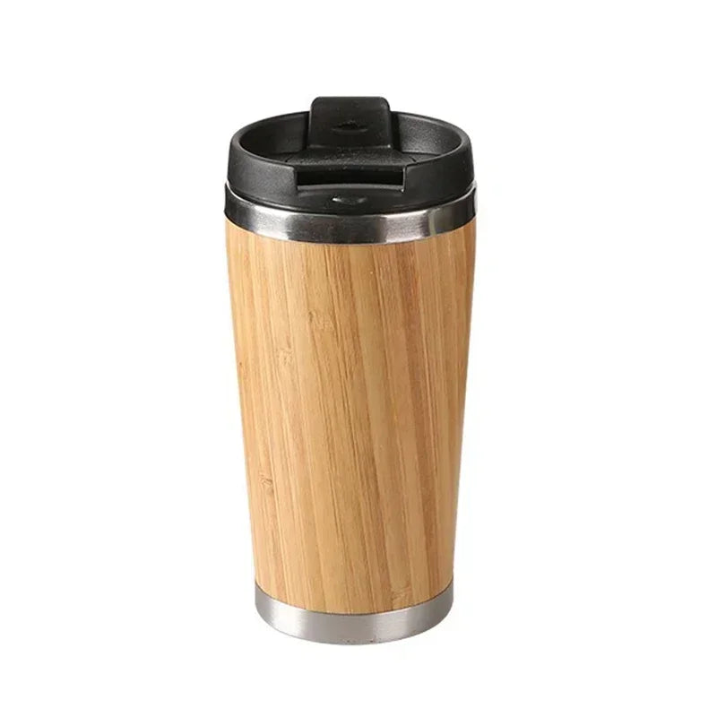 Bamboo travel mug with black lid on a white background