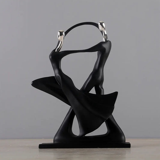 Black abstract sculpture on a gray background