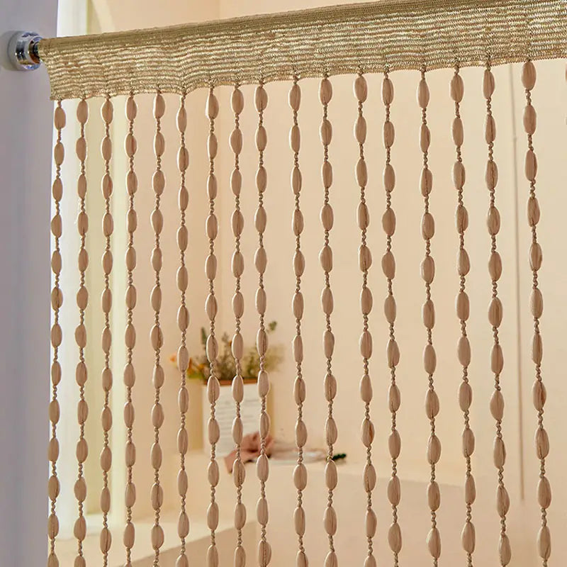 Beaded curtain with a neutral color scheme in a room setting