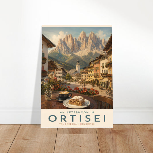 Ortisei travel poster displayed in a bright modern room with wooden flooring, showcasing the colourful alpine village and dramatic Dolomite mountain scenery.
