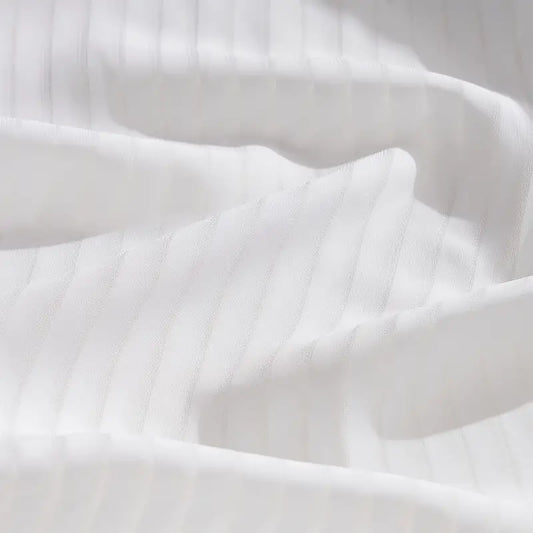 Close-up of white fabric with folds