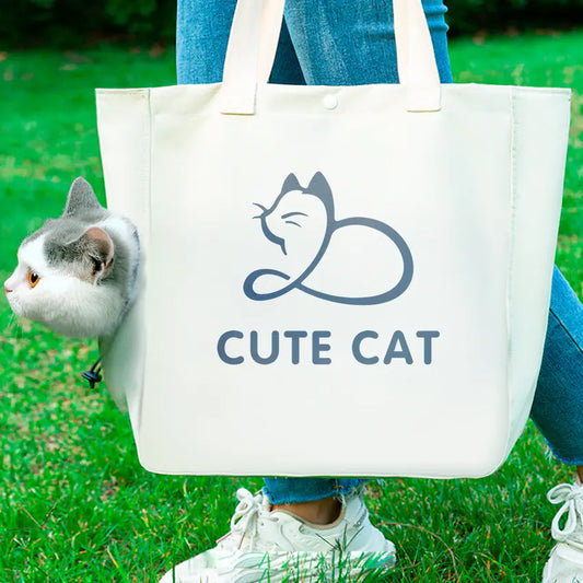 Tote bag with 'Cute Cat' design held by a person outdoors
