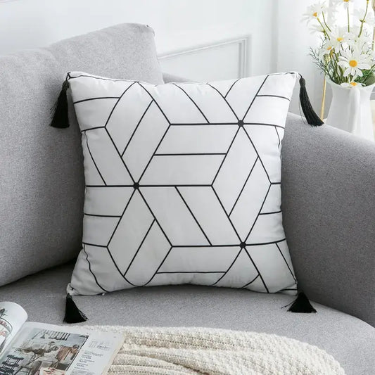 Nordic bohemian style cushion cover with minimalist geometric pattern on a modern grey sofa, surrounded by cozy neutral-toned decor