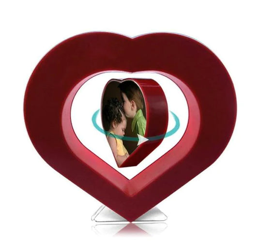 Heart-shaped photo frame with a picture of a couple inside on a white background