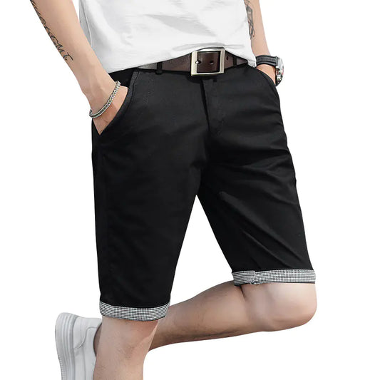 A pair of beige men's casual sports shorts with a mid-waist fit and adjustable drawstring closure, worn by a model.
