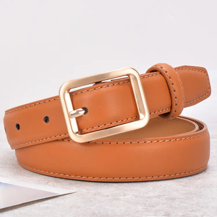 Brown leather belt with a gold buckle on a light gray background
