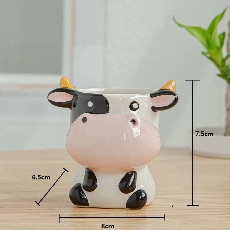 Cow-shaped planter with measurements on a wooden surface
