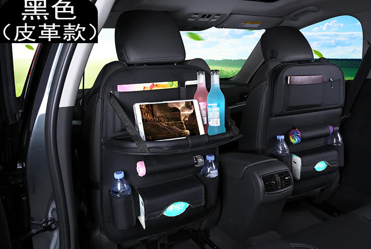 Car back seat organizer with various items in a vehicle