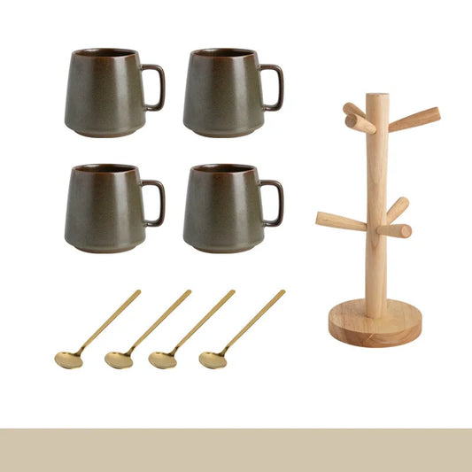 Set of four dark brown mugs, four wooden spoons, and a wooden stand on a white background.