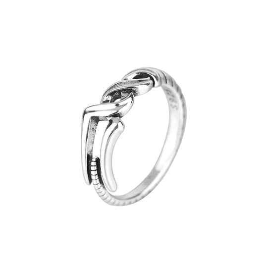 Silver ring with a unique design on a white background