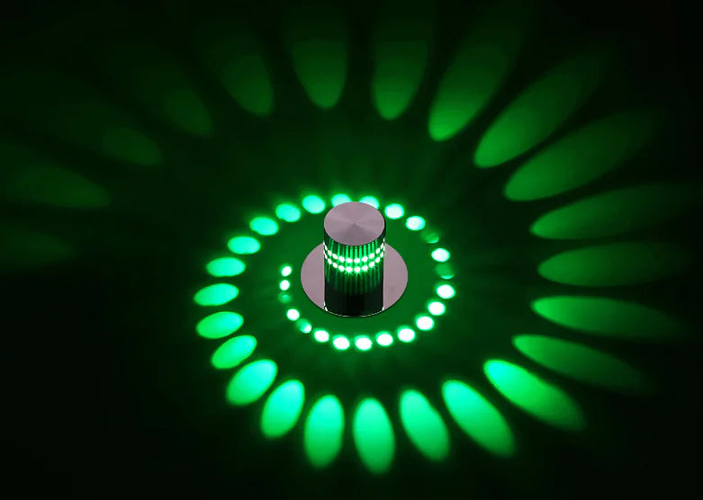 Circular light fixture with green LED lights on a dark background