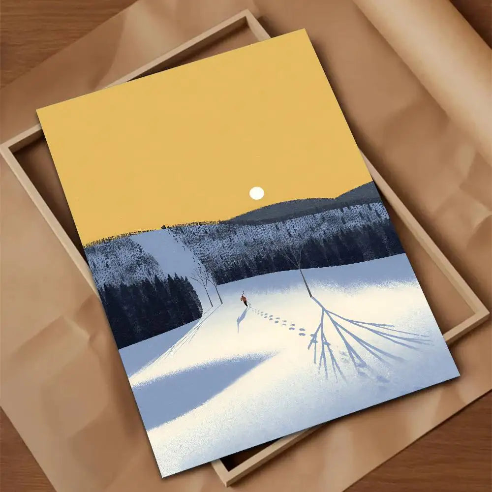 Framed artwork of a winter landscape with a person walking on a snow-covered path.