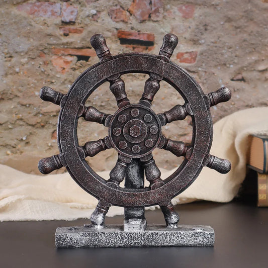 Decorative ship's wheel on a stand against a rustic brick wall background