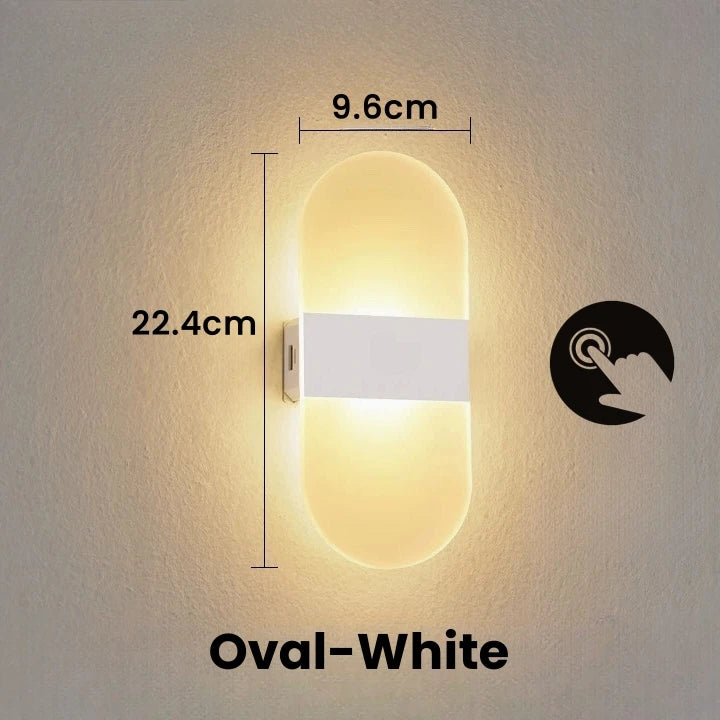 Wall-mounted oval light fixture with dimensions and a nightlight symbol on a neutral background