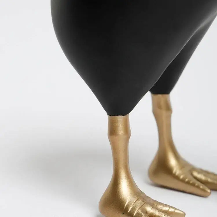 Close up view of the Gold feet of the modern bird figurine