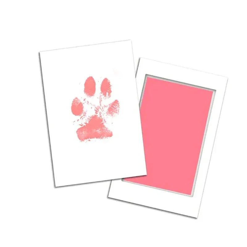 Notebook with a pink paw print on the cover and a matching pink interior