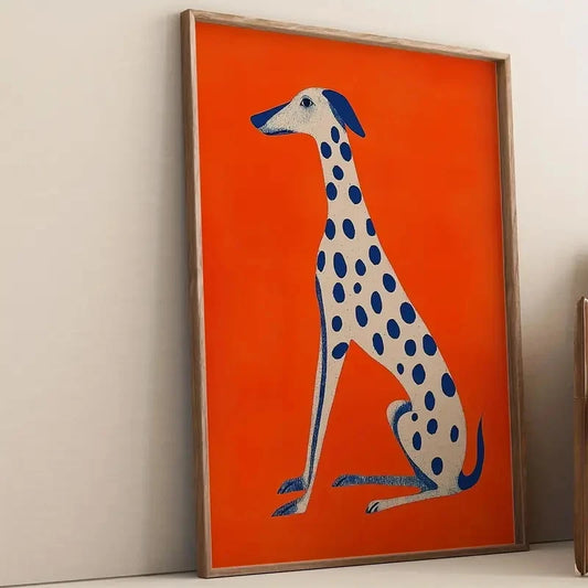 Framed artwork of a dog with blue spots on an orange background