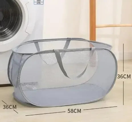 Mesh laundry basket with dimensions displayed in front of a washing machine.
