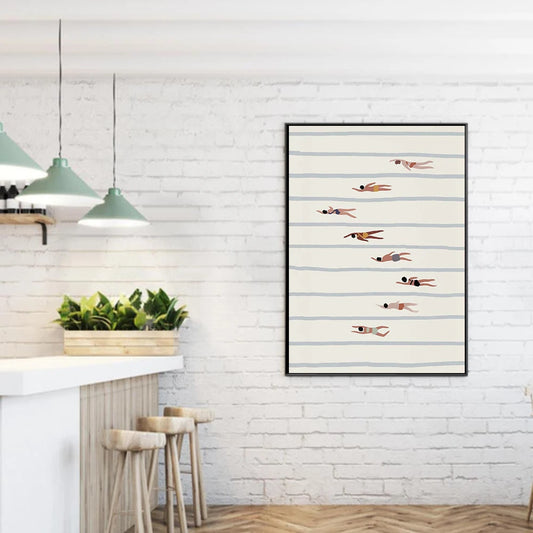 Framed artwork of swimmers on a white brick wall with pendant lights and stools.