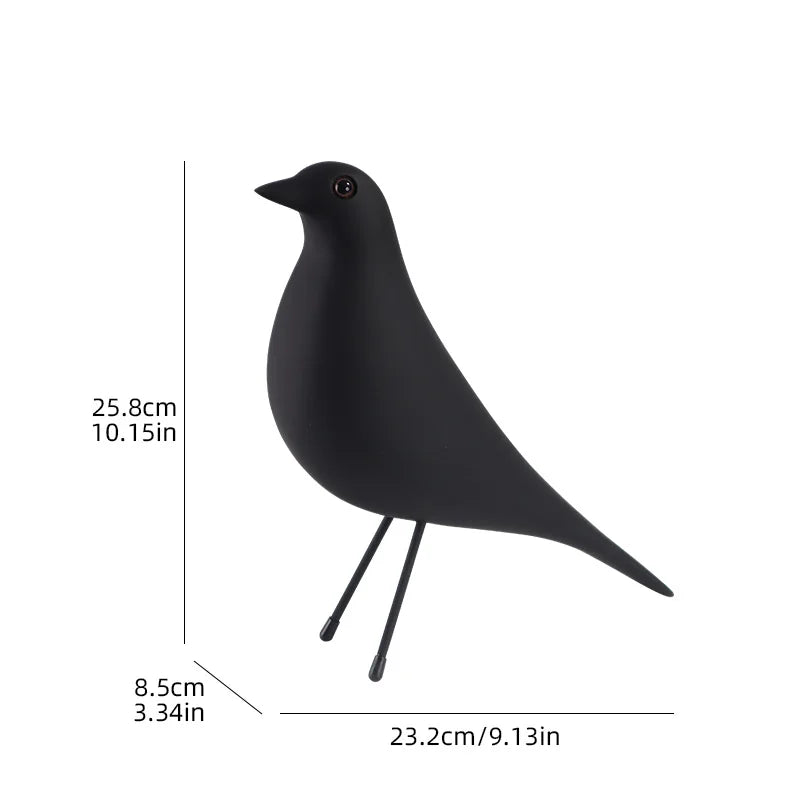 Black bird-shaped object with measurements on a white background