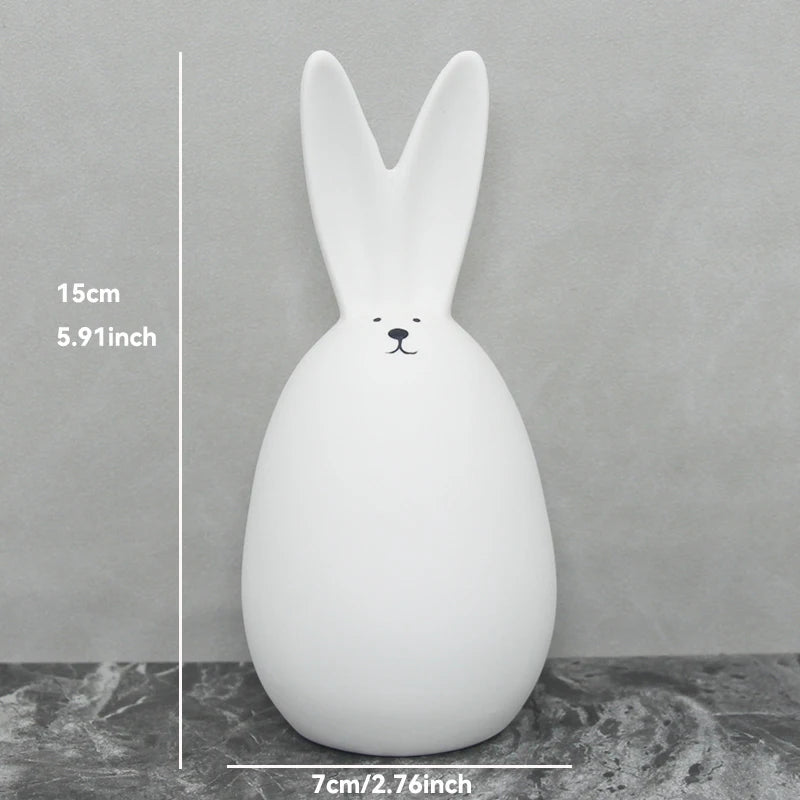 White rabbit-shaped night light with measurements on a gray background