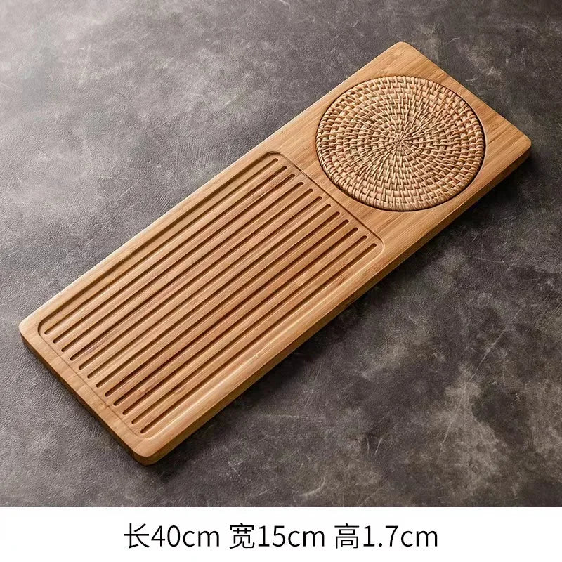 Bamboo Wooden tea tray with woven design on a gray surface