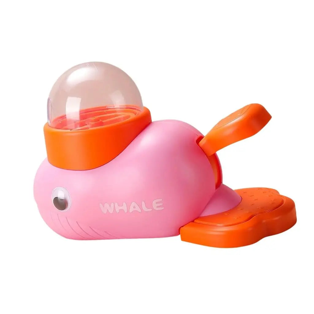 Pink and orange toy whale on a white background