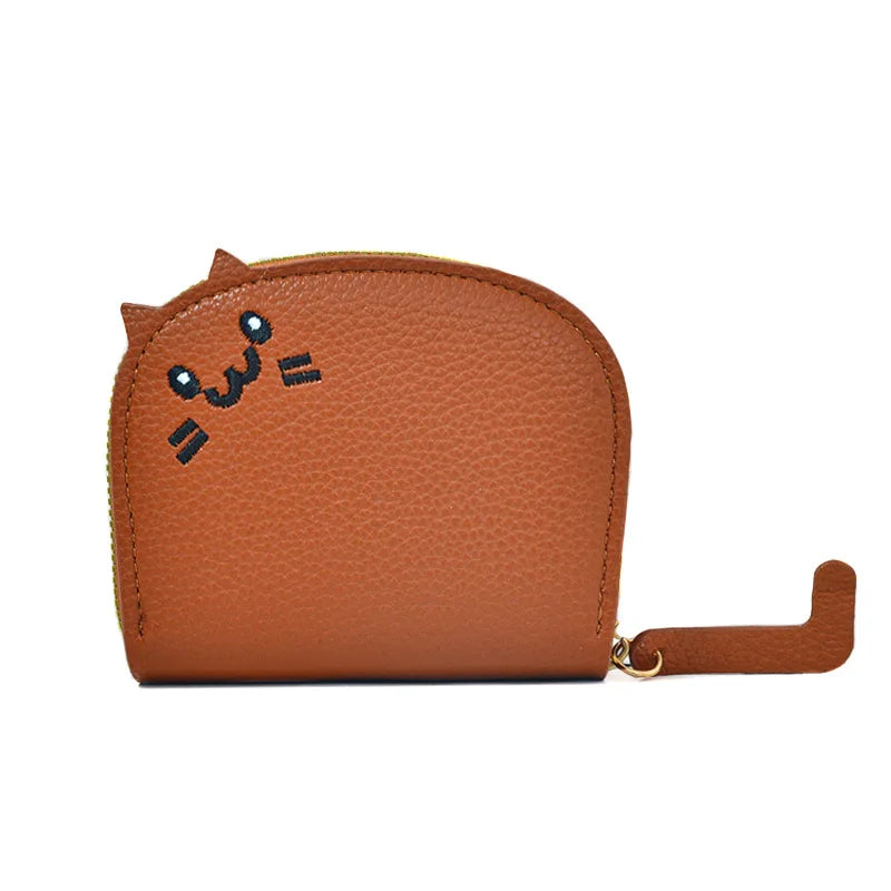 Brown wallet with a cat face design on a white background