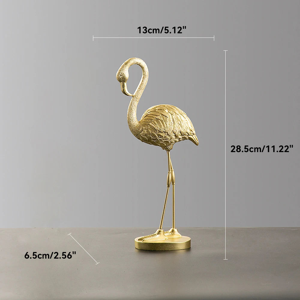 Gold flamingo figurine with measurements on a gray background