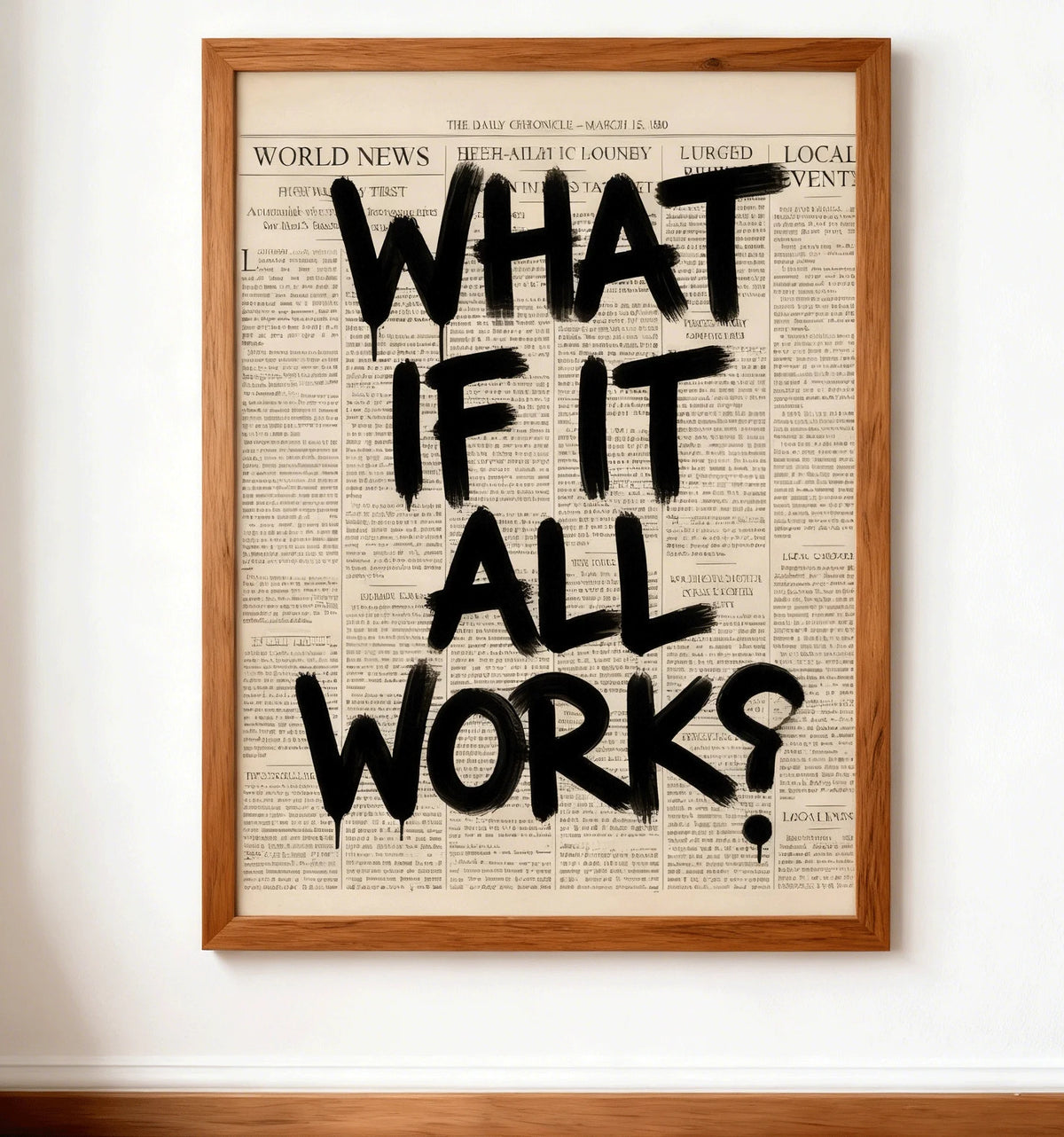 Framed print with 'What If It All Works?' text on a newspaper background