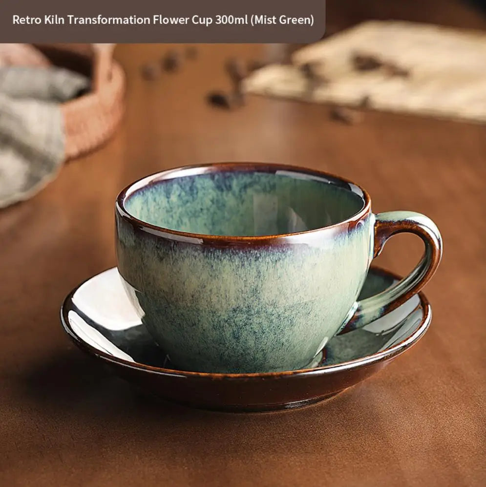 Retro-style ceramic cup and saucer with a green and brown glaze on a wooden surface.