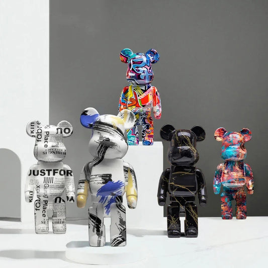 Collection of colorful and patterned bear figurines on a gray background