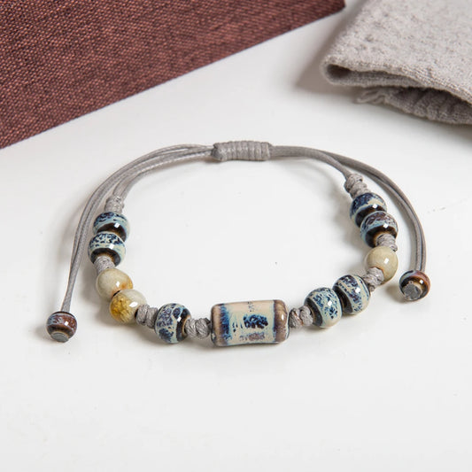 Bracelet with ceramic beads on a white surface