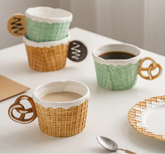 Three ceramic mugs with waffle design handles on a white surface