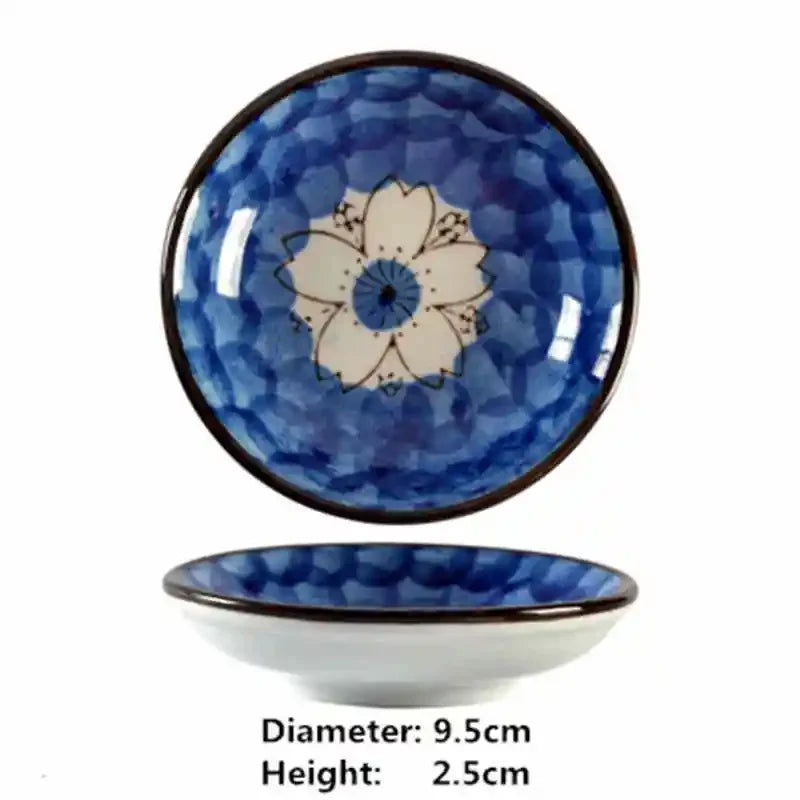 Blue ceramic plate with floral design on a white background