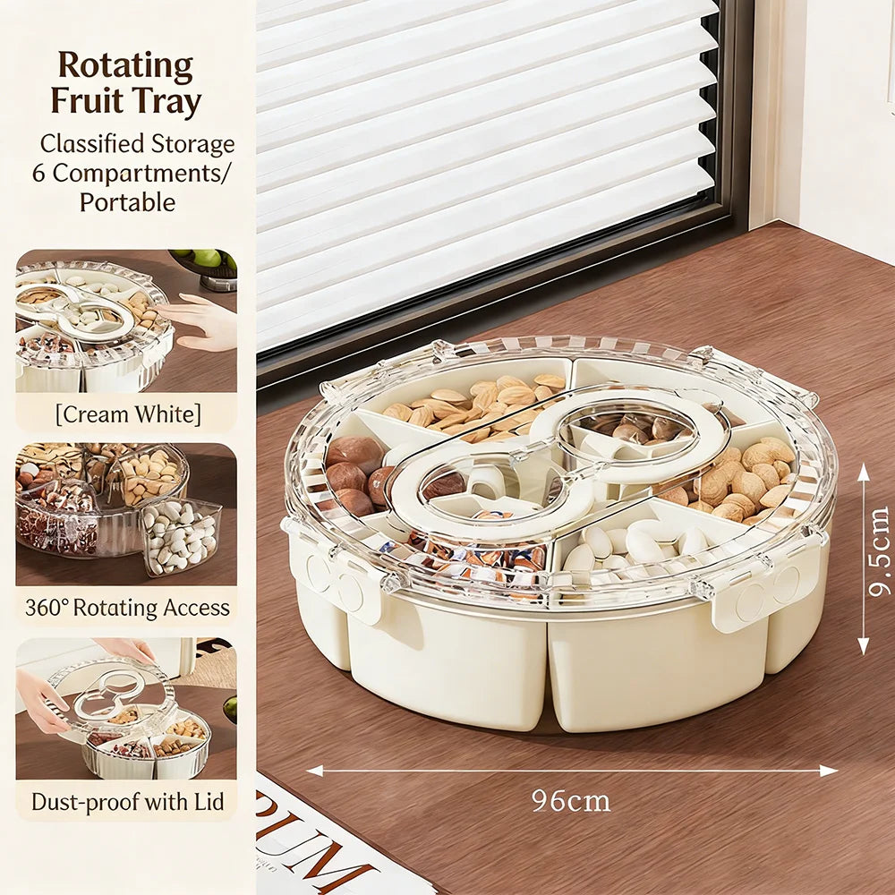 Rotating fruit tray with compartments on a wooden surface, showing nuts and dried fruits.