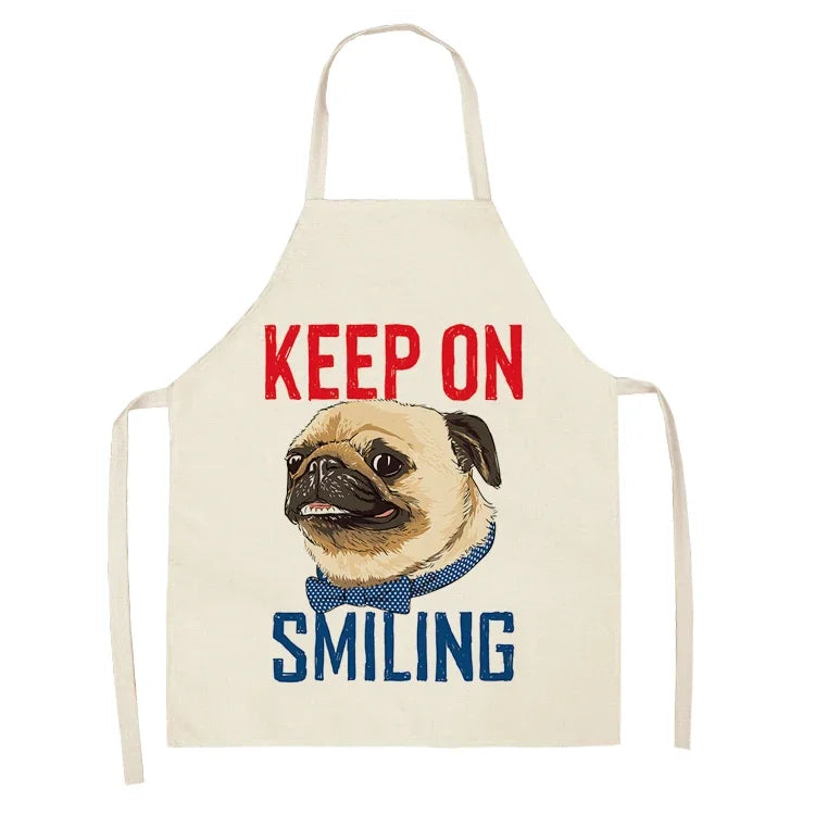 Beige apron with a pug illustration and 'Keep on Smiling' text on a white background