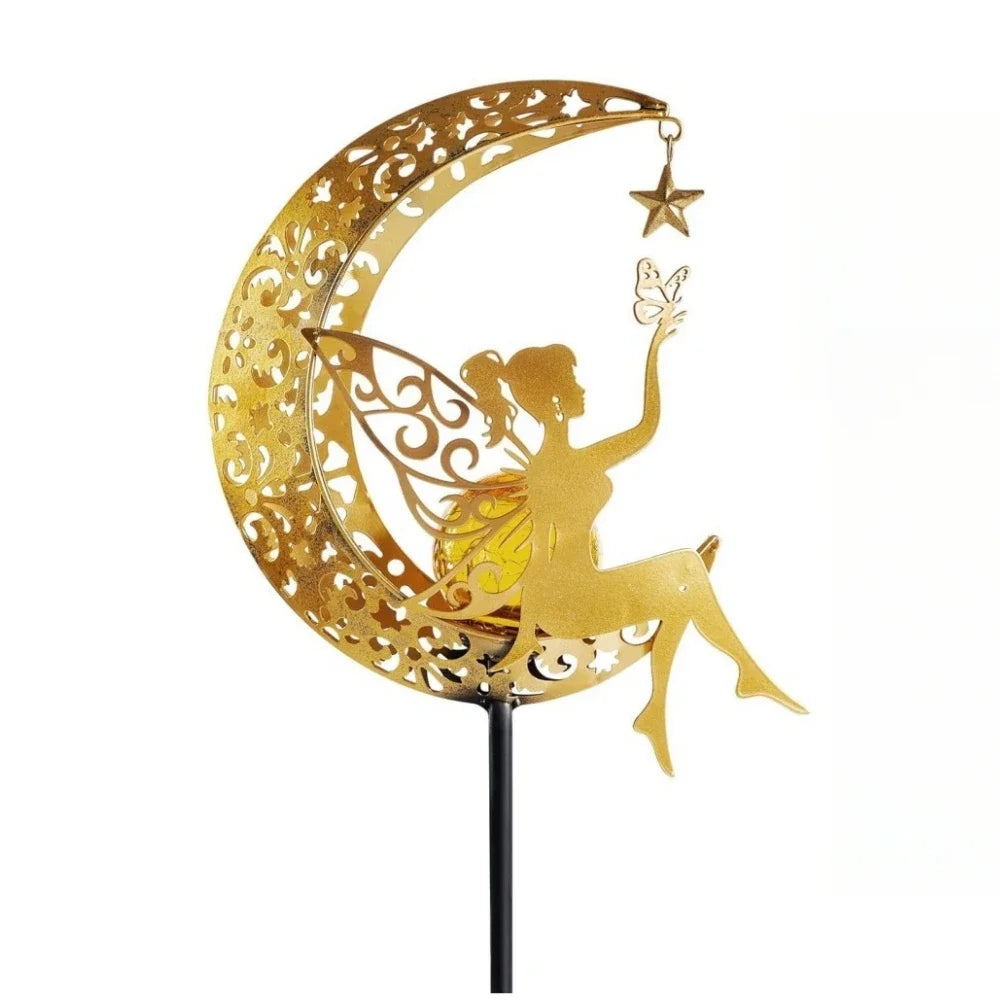 Decorative metal solar light of a fairy on a crescent moon with a star, gold in color.