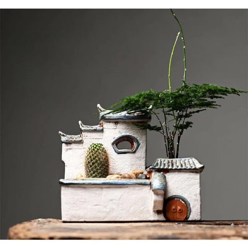 Small architectural model with decorative elements on a wooden surface