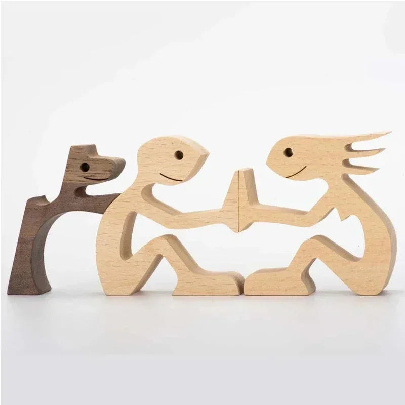 Wooden figurines of a dog, person, and lizard on a white background