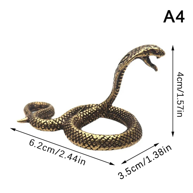 Bronze snake figurine with measurements on a white background