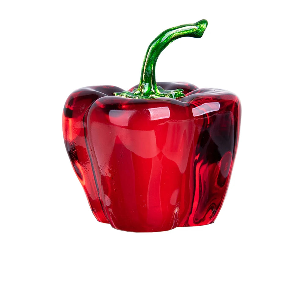 Red glass pepper with green stem on a white background