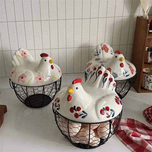 Three ceramic chicken-shaped cookie jars with wire bases on a kitchen counter.