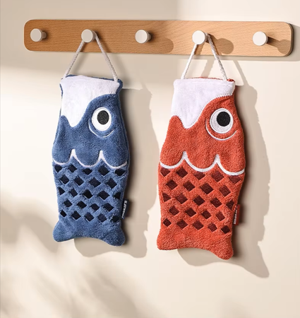 Cute Koi Fish shaped hand towels hanging on a hook in red and blue