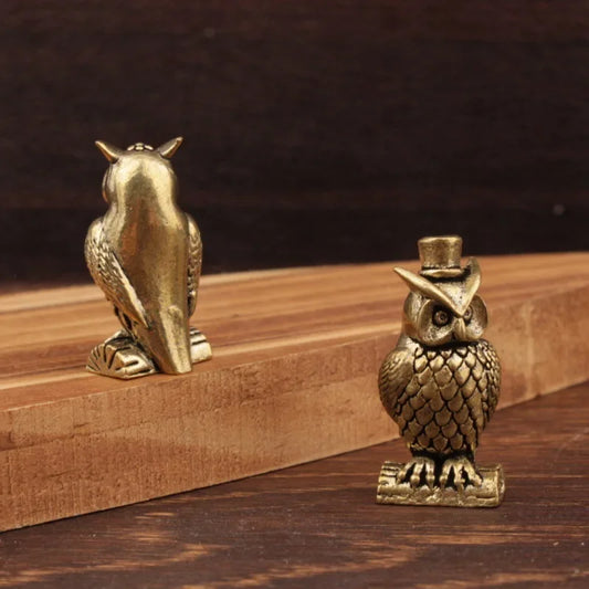 Small brass animal ornament figurine with detailed finish placed on a desk as decorative accent