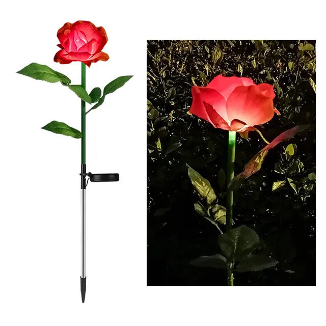 Red LED rose light on a white background with a dark outdoor setting showing its glow.