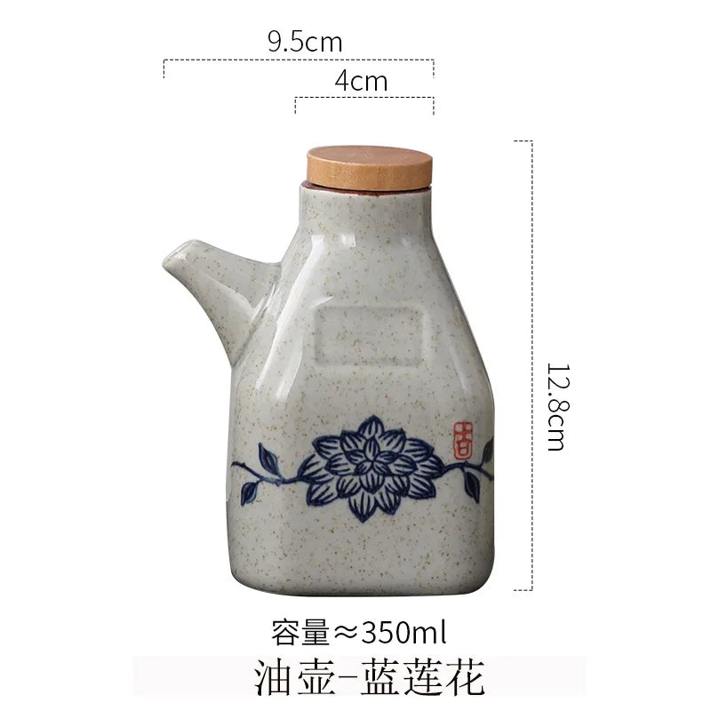 Ceramic oil container with floral design and measurements on a white background